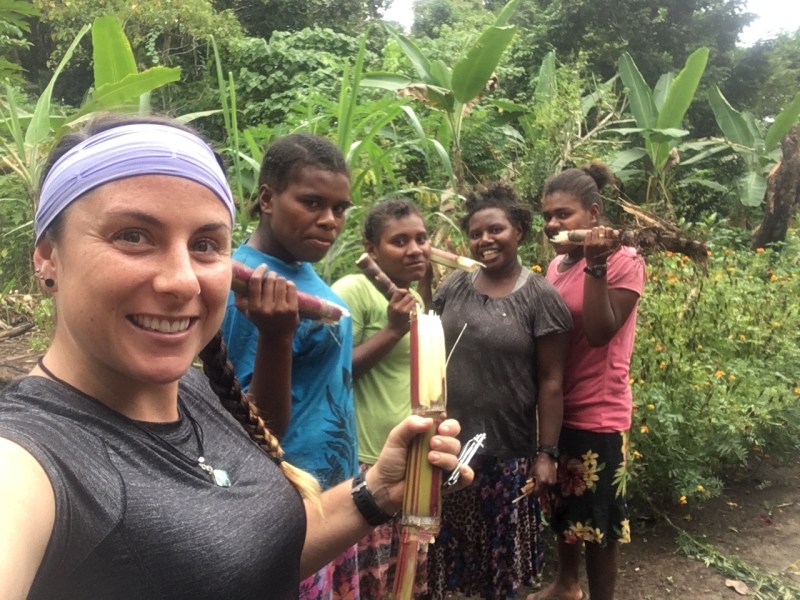 Our group enjoying sugar cane